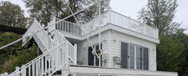 700 Rock Beach Rd, Irondequoit, NY 14617 - view of side of property with a balcony and stairs