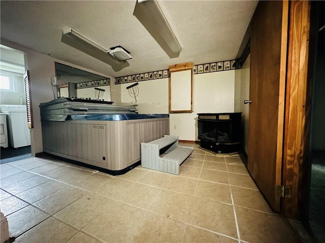 218 Grant St, Elmira-City, NY 14901 - bathroom featuring washer / dryer, tile patterned floors, and a textured ceiling