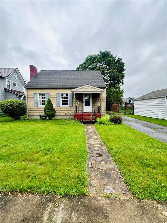 218 Grant St, Elmira-City, NY 14901 - view of front of property with a front yard, a chimney, and roof with shingles