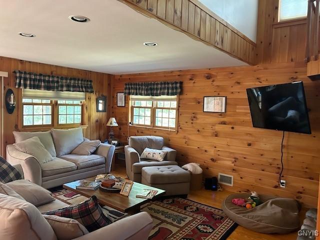 103 Onondaga Rd, Webb, NY 13420 - living area with wooden walls and wood finished floors
