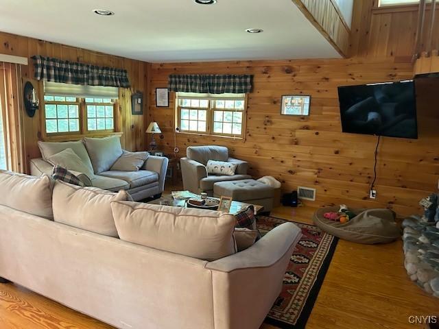 103 Onondaga Rd, Webb, NY 13420 - living room featuring light wood-style flooring, wood walls, and recessed lighting
