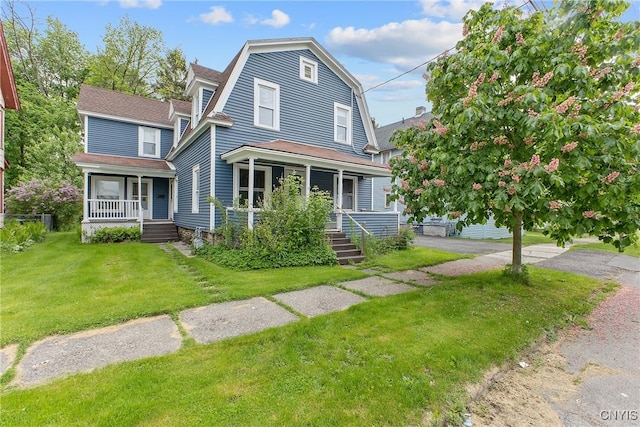 10 Garfield St Unit 10, Cortland, NY 13045 - dutch colonial featuring covered porch, a front yard, a gambrel roof, and a shingled roof