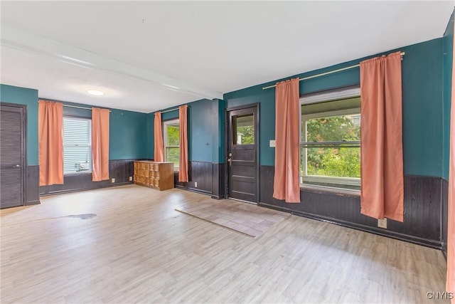 10 Garfield St Unit 10, Cortland, NY 13045 - empty room featuring wood finished floors and a wainscoted wall