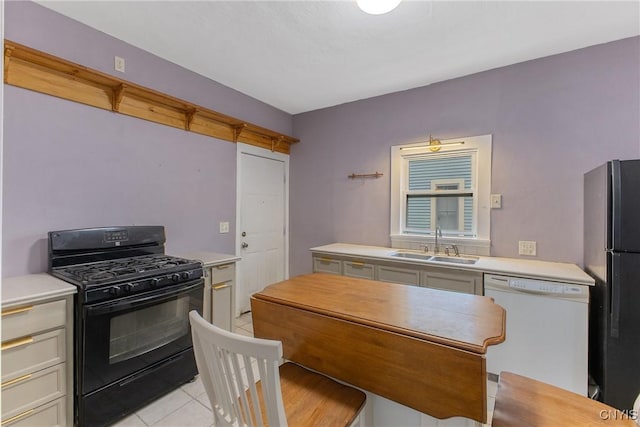 10 Garfield St Unit 10, Cortland, NY 13045 - kitchen featuring black appliances, a sink, and light countertops