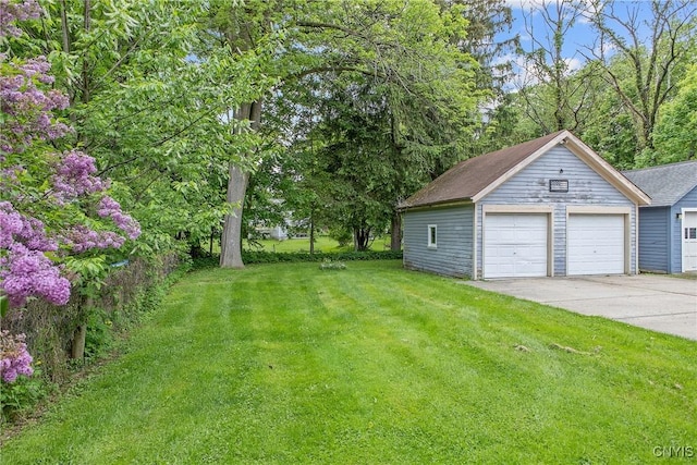 10 Garfield St Unit 10, Cortland, NY 13045 - view of green lawn with a garage and an outdoor structure