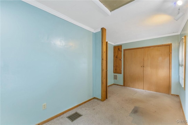 10 Garfield St Unit 10, Cortland, NY 13045 - unfurnished bedroom with ornamental molding, carpet, baseboards, and a closet