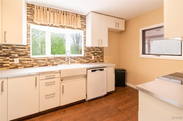 8929 State Route 12e, Lyme, NY 13622 - kitchen with dishwasher, a sink, backsplash, and light countertops