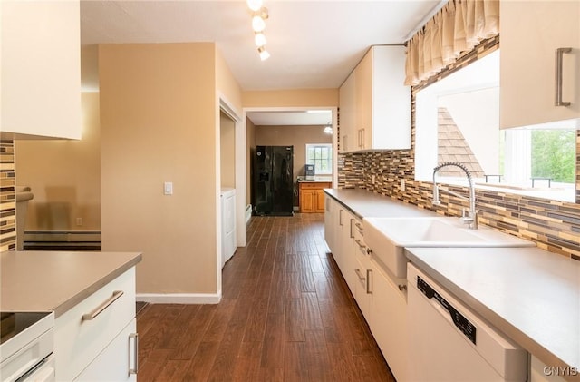 8929 State Route 12e, Lyme, NY 13622 - kitchen featuring white dishwasher, a sink, black fridge with ice dispenser, and tasteful backsplash