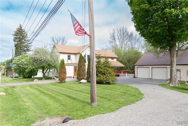 8929 State Route 12e, Lyme, NY 13622 - view of front facade with a front yard, a detached garage, and an outdoor structure