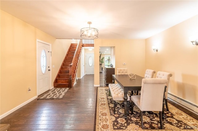 8929 State Route 12e, Lyme, NY 13622 - dining space featuring dark wood-style flooring, a baseboard radiator, stairs, and a chandelier