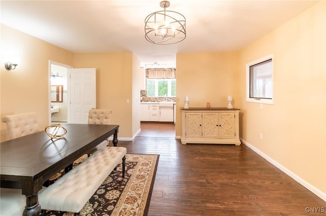 8929 State Route 12e, Lyme, NY 13622 - dining area with dark wood-style flooring, baseboards, and a chandelier