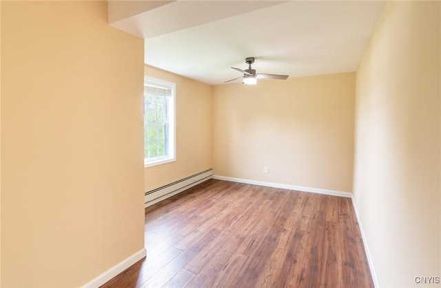8929 State Route 12e, Lyme, NY 13622 - unfurnished room featuring a baseboard heating unit, ceiling fan, wood finished floors, and baseboards