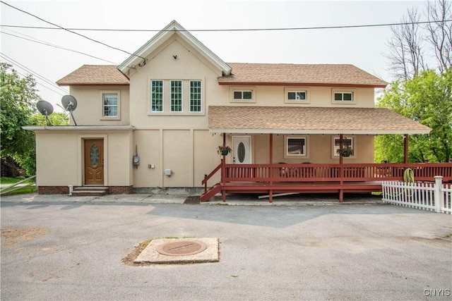 8929 State Route 12e, Lyme, NY 13622 - view of front of home with stucco siding, entry steps, and a porch