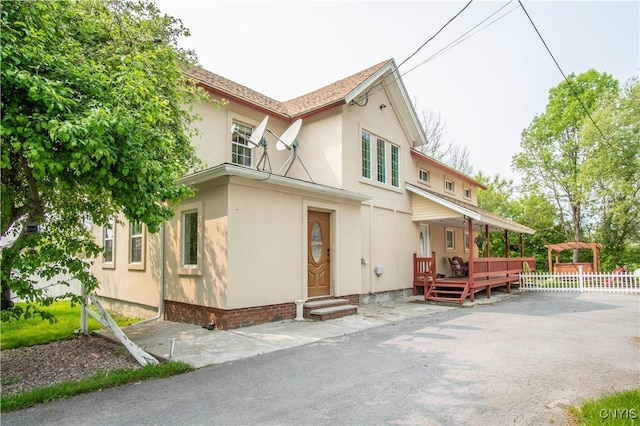 8929 State Route 12e, Lyme, NY 13622 - view of side of property featuring a wooden deck and stucco siding