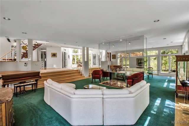 52 Hidden Pines Ct, Amherst, NY 14051 - carpeted living room featuring track lighting, stairs, and recessed lighting