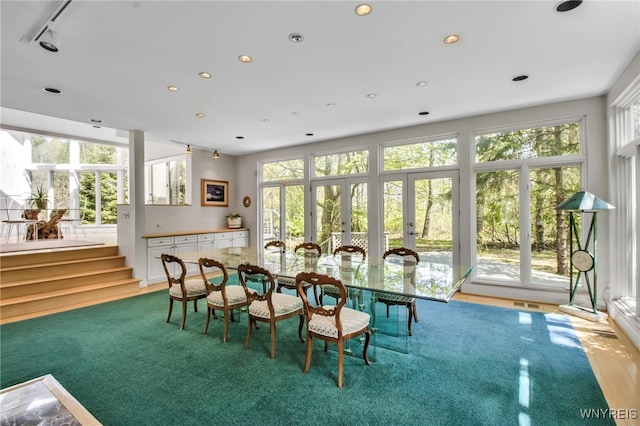 52 Hidden Pines Ct, Amherst, NY 14051 - dining room featuring healthy amount of natural light, recessed lighting, french doors, and wood finished floors