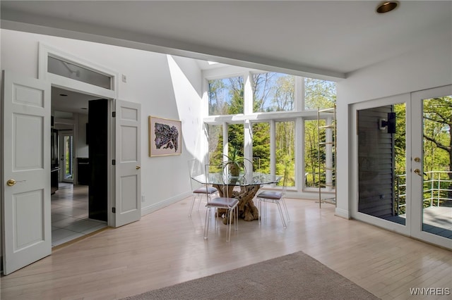 52 Hidden Pines Ct, Amherst, NY 14051 - dining room with wood finished floors, baseboards, and french doors
