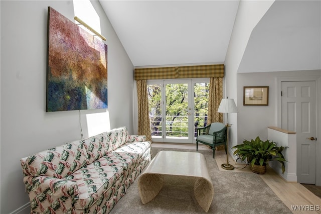 52 Hidden Pines Ct, Amherst, NY 14051 - living room featuring vaulted ceiling, baseboards, and wood finished floors