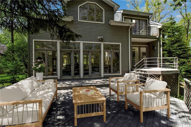 52 Hidden Pines Ct, Amherst, NY 14051 - rear view of house with a balcony, outdoor lounge area, french doors, and a deck