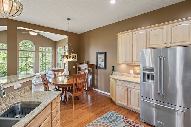 4166 Angela Way, Gorham, NY 14424 - kitchen featuring high end fridge, light brown cabinets, a sink, light wood-style flooring, and vaulted ceiling