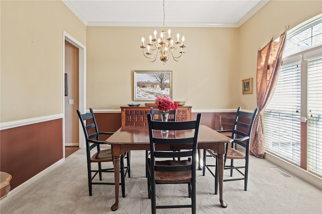 4166 Angela Way, Gorham, NY 14424 - dining area featuring light colored carpet, a chandelier, ornamental molding, and baseboards