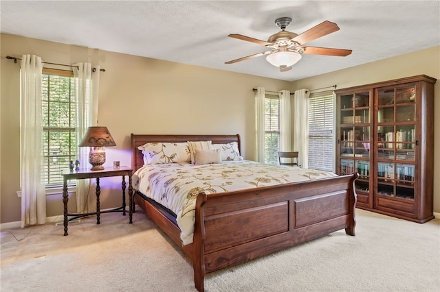 4166 Angela Way, Gorham, NY 14424 - bedroom with light colored carpet, multiple windows, and baseboards