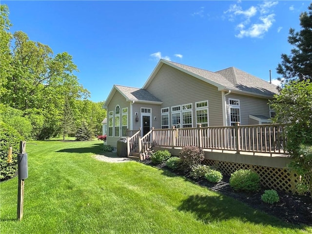 4166 Angela Way, Gorham, NY 14424 - rear view of property featuring a lawn, a deck, and roof with shingles