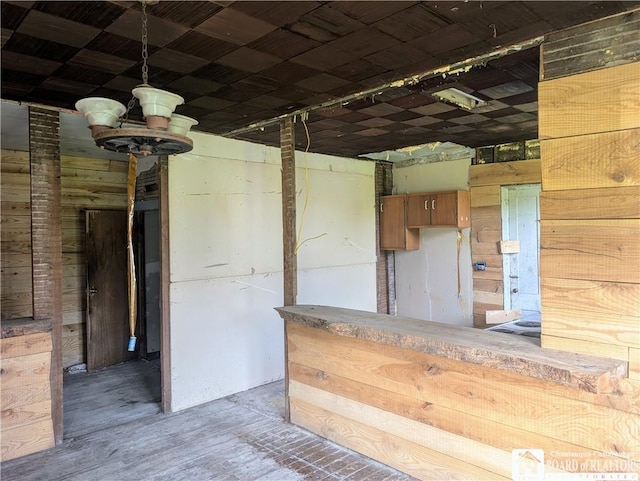132 Kipp St, Sherman, NY 14781 - kitchen featuring wood walls, hanging light fixtures, and a chandelier