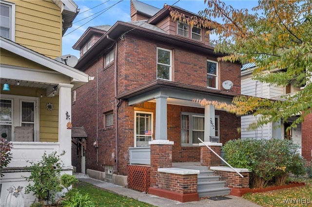 2452 Niagara Ave, Niagara Falls, NY 14305 - american foursquare style home with a porch and brick siding