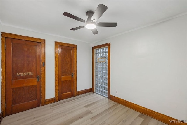2452 Niagara Ave, Niagara Falls, NY 14305 - unfurnished bedroom featuring light wood-style flooring, baseboards, crown molding, and ceiling fan