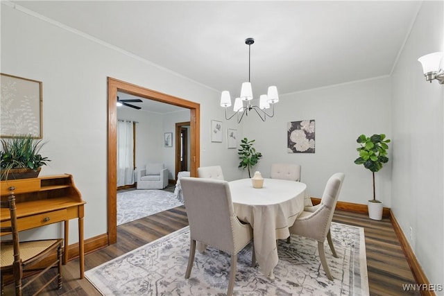 2452 Niagara Ave, Niagara Falls, NY 14305 - dining space featuring a chandelier, dark wood-style flooring, ornamental molding, and baseboards