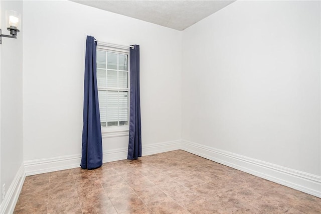 189 5th St, Rochester, NY 14605 - unfurnished room featuring baseboards and a textured ceiling