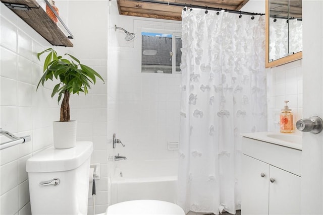 189 5th St, Rochester, NY 14605 - full bath featuring tile walls, toilet, shower / bath combo with shower curtain, and vanity