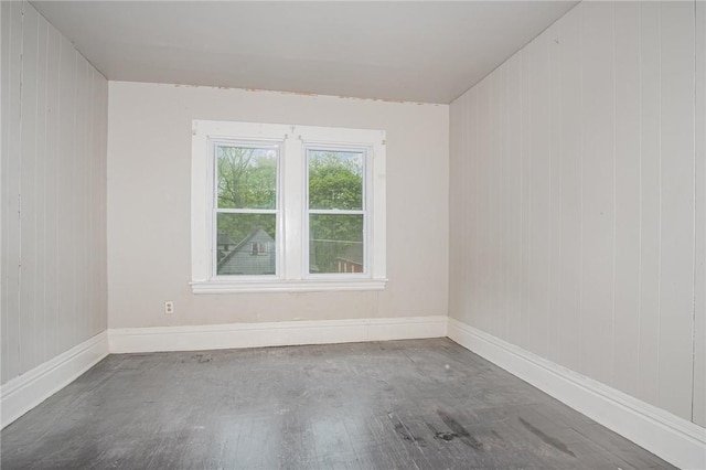 189 5th St, Rochester, NY 14605 - unfurnished room with baseboards and wooden walls
