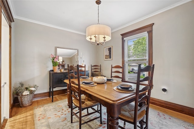 34-36 Hamilton Ave, Auburn, NY 13021 - dining area featuring light wood-style floors, crown molding, baseboards, and a chandelier