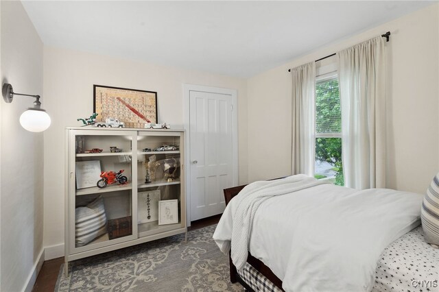 34-36 Hamilton Ave, Auburn, NY 13021 - bedroom with baseboards and wood finished floors