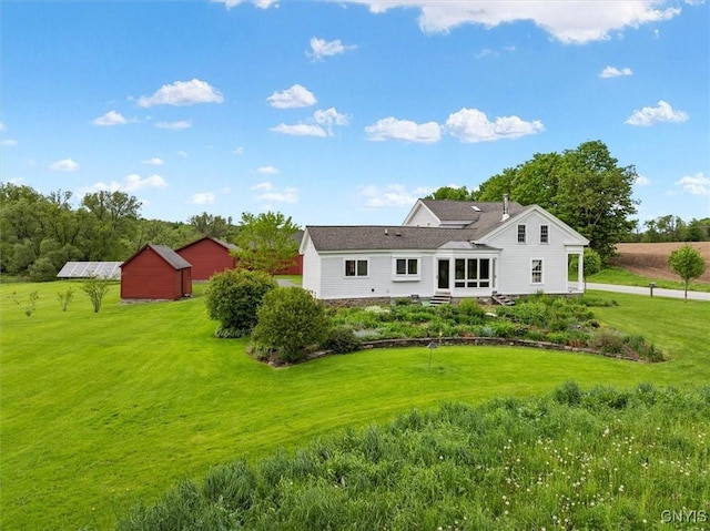537 Earlville Rd, Hamilton, NY 13332 - rear view of house featuring a lawn and an outdoor structure