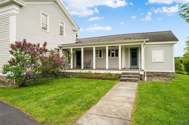 537 Earlville Rd, Hamilton, NY 13332 - view of front facade with covered porch, a front lawn, and a shingled roof