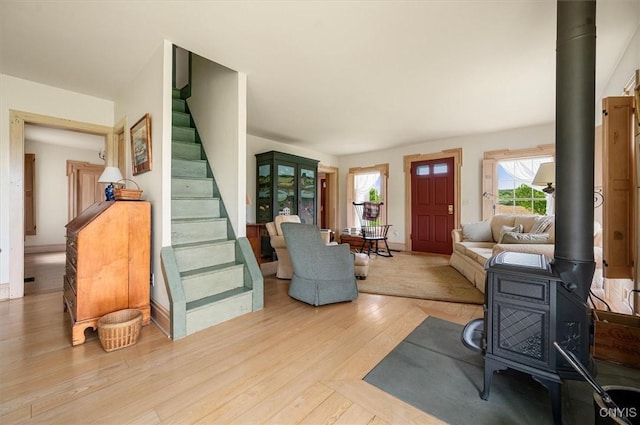 537 Earlville Rd, Hamilton, NY 13332 - foyer entrance featuring a wood stove, healthy amount of natural light, and wood finished floors