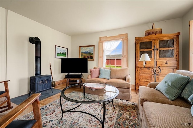 537 Earlville Rd, Hamilton, NY 13332 - living room with wood finished floors and a wood stove