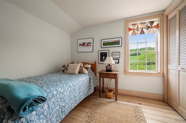 537 Earlville Rd, Hamilton, NY 13332 - bedroom with light wood-style floors, baseboards, and lofted ceiling