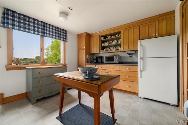 537 Earlville Rd, Hamilton, NY 13332 - kitchen featuring freestanding refrigerator, open shelves, brown cabinets, and light tile patterned flooring