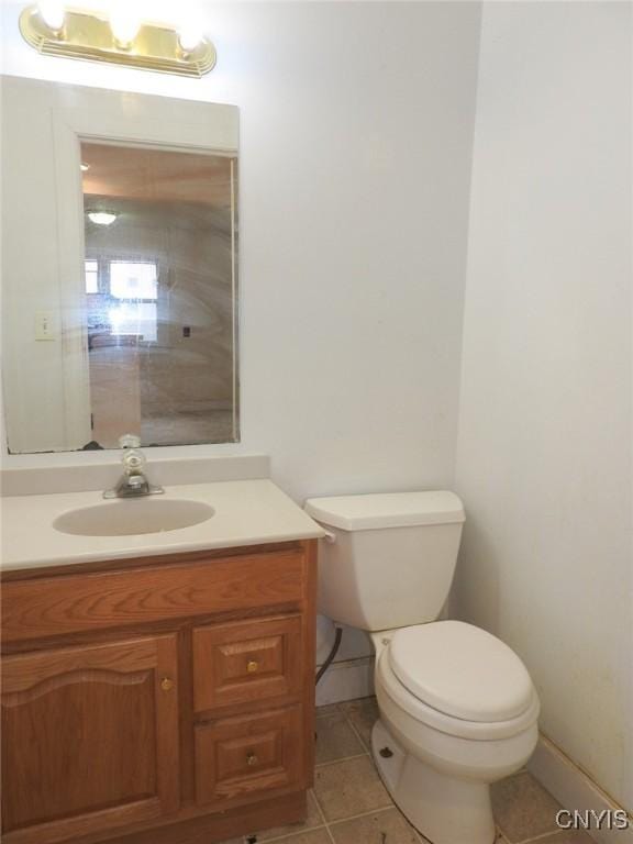 5 Evergreen St, Cortland, NY 13045 - bathroom featuring toilet, vanity, tile patterned flooring, and baseboards