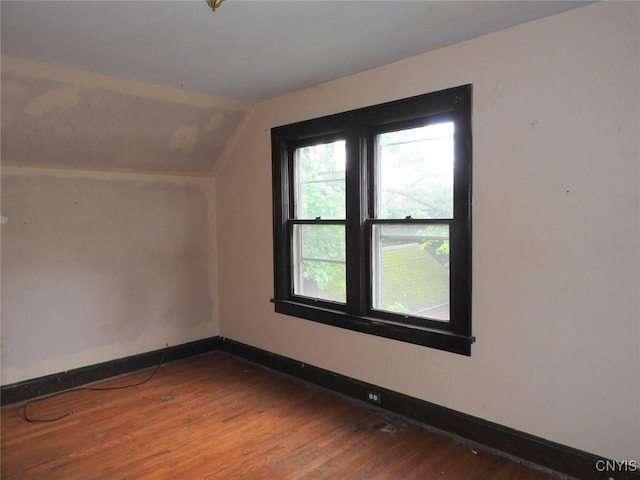 5 Evergreen St, Cortland, NY 13045 - additional living space with lofted ceiling, wood finished floors, and baseboards