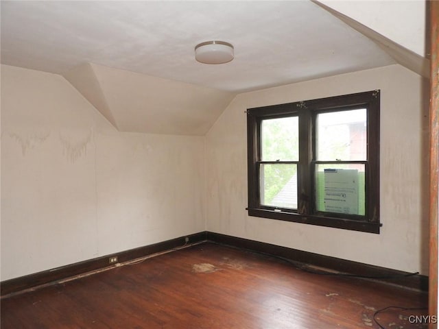 5 Evergreen St, Cortland, NY 13045 - additional living space featuring dark wood-style floors, vaulted ceiling, and baseboards
