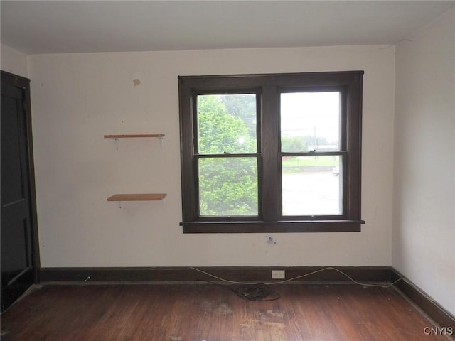 5 Evergreen St, Cortland, NY 13045 - spare room with dark wood-style flooring and baseboards