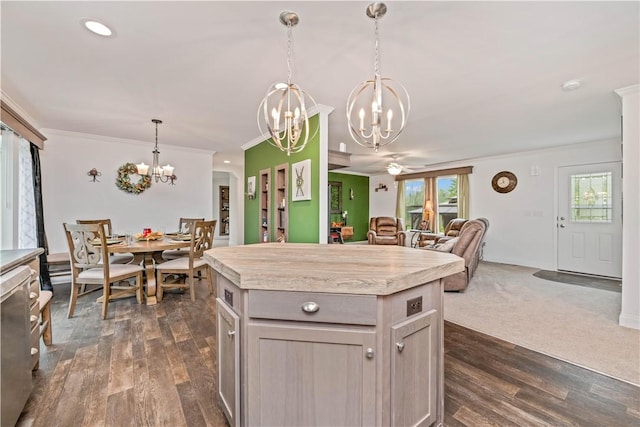 3854 Tari Ln, Murray, NY 14470 - kitchen featuring a chandelier, light countertops, dark wood finished floors, open floor plan, and ornamental molding