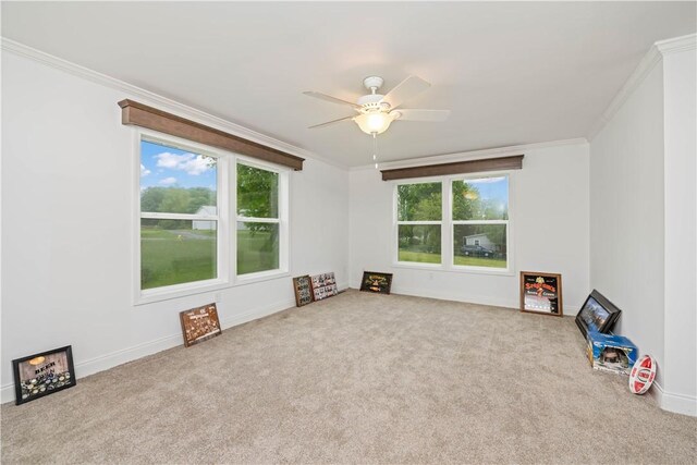 3854 Tari Ln, Murray, NY 14470 - spare room featuring carpet, crown molding, a ceiling fan, and baseboards
