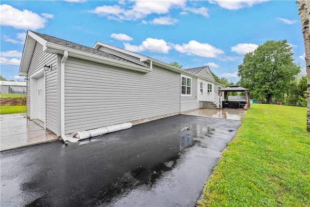 3854 Tari Ln, Murray, NY 14470 - view of home's exterior with a gazebo, a yard, a shingled roof, and a garage
