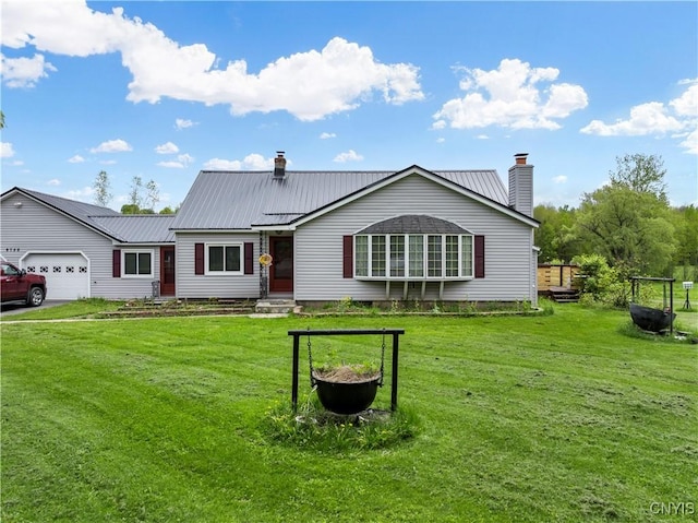 9748-9736 Podunk Rd, Lee, NY 13363 - view of front of home featuring a chimney, a garage, and a front yard